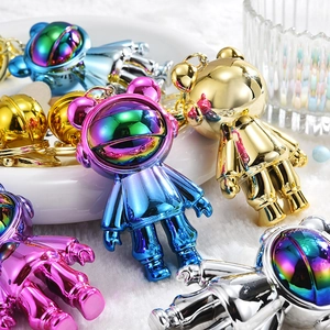 Futuristic astronaut bear keychain set with metallic finish in various vibrant colors