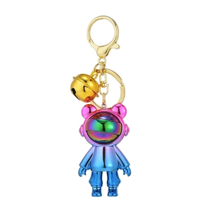 Gradient color astronaut bear keychain with metallic finish and golden bell accessory