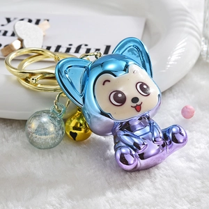 Cute blue-purple gradient fox keychain with golden bell and transparent charm on fur