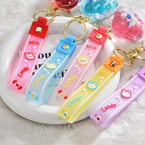 Detail of candy-colored silicone keychain set with glitter stars and cute rabbit charms