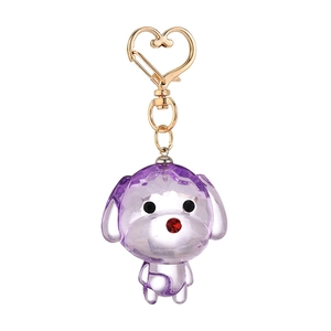 Purple crystal dog keychain with gold heart-shaped clip on a clean white background