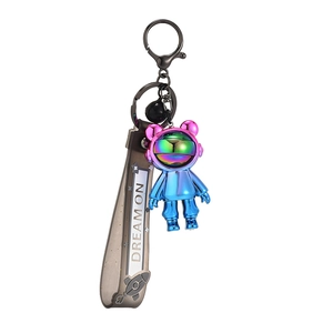 Plated astronaut keychain with Dream On strap and colorful mirror finish effect