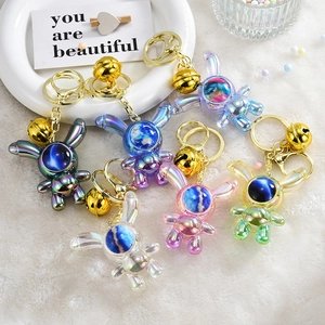 Gradient astronaut rabbit keychain set with metallic star mask and golden bell accessories