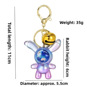 Detailed dimensions of a gradient purple acrylic bunny keychain with starry globe inside