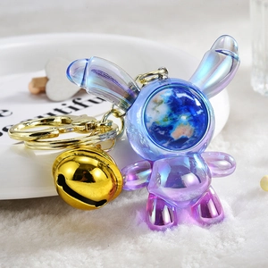 Creative gradient astronaut rabbit keychain with metallic finish and gold bell charm