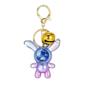 Space rabbit keychain in gradient purple acrylic with a globe face and golden bell charm