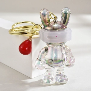 Detail of colorful gradient bunny astronaut keychain with pearl finish and China text