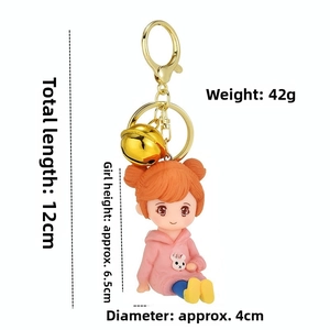 Cartoon girl keychain with pink rabbit hoodie and gold bell, length 12cm, weight 42g
