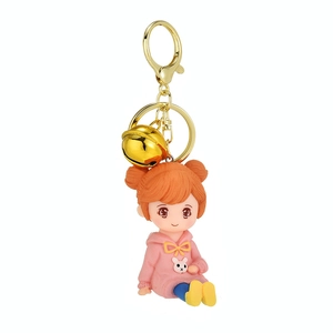 Cute girl keychain with pink bunny hoodie and gold bell, creative backpack charm accessory