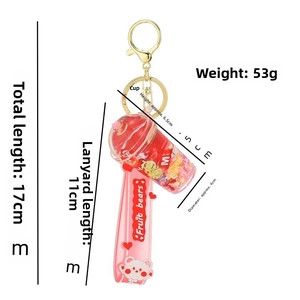 Detail showing dimensions of red fruit bear milk tea cup keychain with liquid glitter