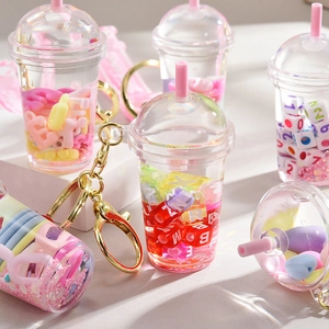 Quicksand milk tea cup keychain with colorful liquid and letter beads and gold clip
