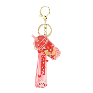 Creative fruit tea liquid keychain with pink wrist strap and golden lobster clasp
