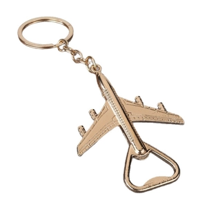 Golden airplane keychain bottle opener with four-engine detail and sleek metal finish