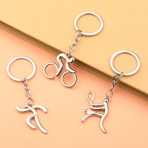 Three silver sports-themed metal keychains featuring cycling, running, and tennis icons