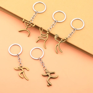Creative bronze alloy sports keychains featuring soccer, running, and music themes