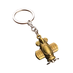 Vintage bronze propeller airplane model metal keychain with classic biplane pendant design