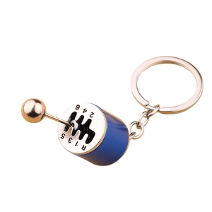 Creative 6-speed manual car gearbox model keychain with blue finish and gold shifter knob
