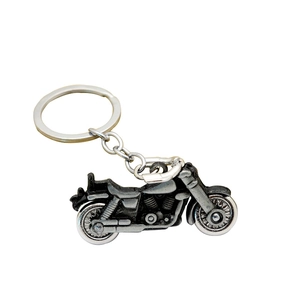 Retro cruise motorcycle keychain with spinning wheels in vintage silver metal finish