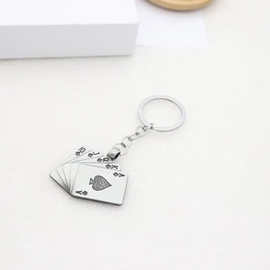 Detail of spade royal flush poker cards keychain made of vintage alloy metal finish