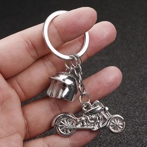 Polished silver motorcycle and helmet pendant keychain set in durable stainless steel