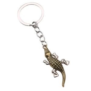 Vintage crocodile metal keychain with bronze and silver scales for car keys or backpack