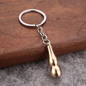 Vintage brass gourd keychain accessory with polished metallic finish for car keys