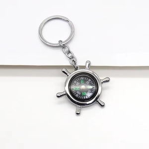 Creative silver metal ship wheel keychain with a functional mini compass pendant