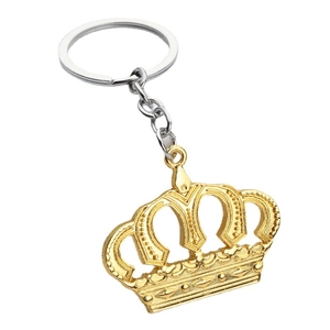 Elegant gold-tone metal crown keychain accessory for car keys shown on white background