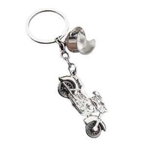 Silver vintage motorcycle and helmet metal keychain with a polished chrome finish