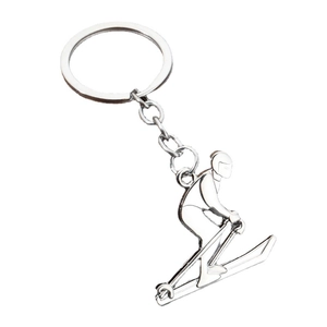 Silver metal skier keychain with polished finish for athletes and sports gift