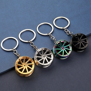 Zinc alloy car wheel rim keychains in gold, silver, rainbow, and black finishes
