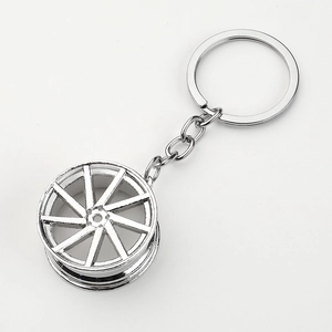 Creative silver zinc alloy keychain featuring a realistic car wheel rim hub pendant