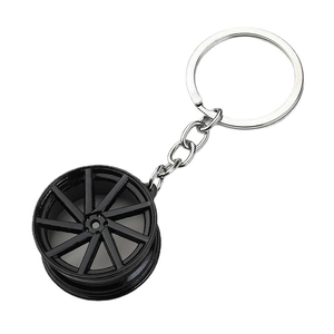 Creative black alloy car wheel rim keychain with silver ring for automotive enthusiasts