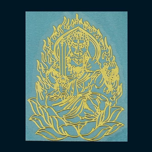 Detailed view of Acala Buddhist deity golden metal sticker with intricate cutout design