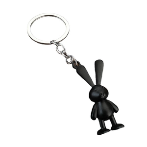 Minimalist matte black space rabbit keychain with silver metal ring on white background