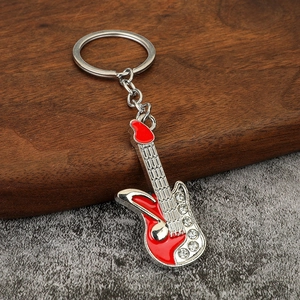 Red electric guitar keychain with silver alloy finish and sparkling rhinestone inlay