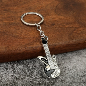Silver electric guitar keychain with black enamel finish and sparkling crystal accents