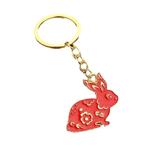Chinese zodiac rabbit keychain with red enamel and gold floral patterns for bags