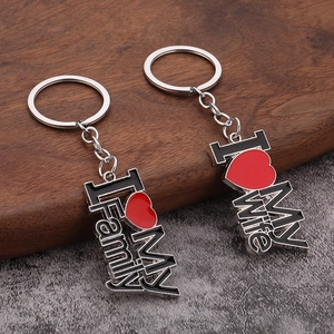 Detail of I Love My Family and I Love My Wife metal keychains with red enamel hearts