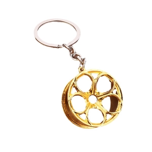 Polished gold metal car wheel rim keychain with a five-spoke design and sturdy ring