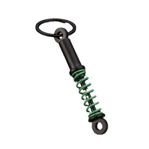 Green and black automotive shock absorber keychain with mechanical metal spring details
