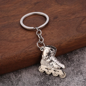 3D silver metal roller skate keychain featuring detailed wheels and a sturdy ring hook