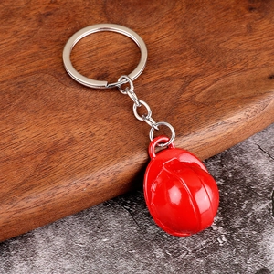 Mini red safety helmet keychain with polished finish and silver metal ring accessory
