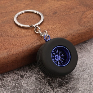 Realistic PVC car tire keychain with blue wheel hub and metallic chain accessory