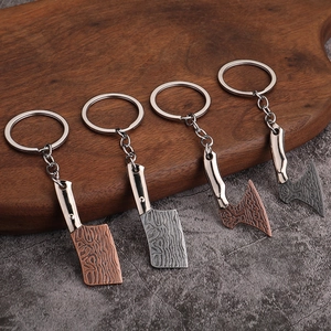 Realistic mini metal cleaver and axe keychains with Damascus patterns on wood base