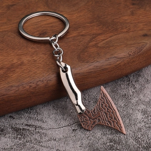 Miniature zinc alloy axe keychain with silver handle and copper finish Damascus blade