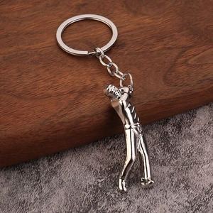 Polished silver zinc alloy golf player keychain with a dynamic golfer silhouette pendant