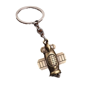 Creative bronze aircraft engine keychain with industrial metal finish on white background