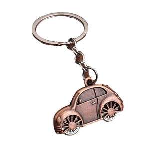 Vintage bronze beetle car keychain made of zinc alloy with detailed retro vehicle design