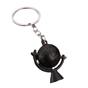 Globe shaped keychain in matte black finish with silver metallic ring on white background